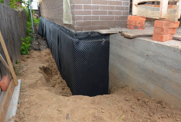 SJ Waterproofing Pros technician performing targeted Interior Drainage System assessment in Belmore, OH